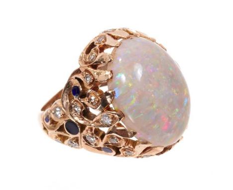 Opal, diamond and enamel cocktail ring with a large oval cabochon opal measuring approximately 19mm x 14mm in pierced gold fo