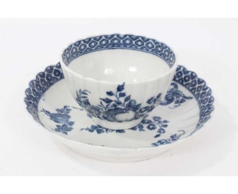 Caughley tea bowl and saucer, circa 1780, of fluted form, printed in blue with the 'Apple' pattern, the saucer measuring 12.7