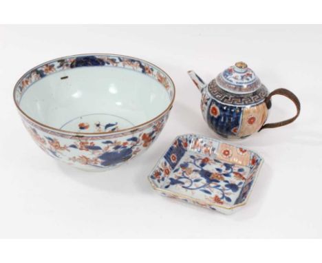 Early 18th century Chinese Kangxi porcelain bowl, teapot, and spoon tray, each decorated with floral patterns in the Imari st