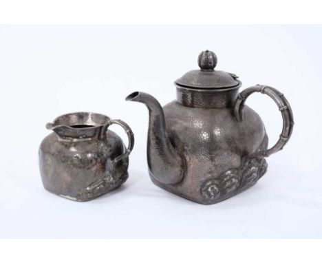 Late 19th/Early 20th century Chinese silver teapot of square form, with spot hammered finish and raised Prunus decoration, si