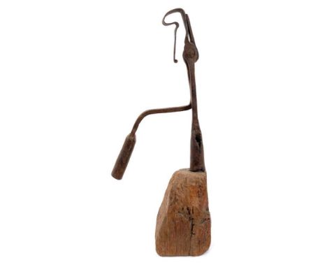 Large 18th century wrought iron nip rush light holder, raised on tapered square wooden base, 44cm high