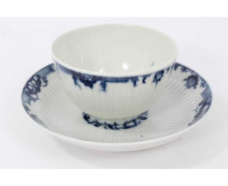 Worcester blue and white fluted tea bowl and saucer, circa 1760, decorated with patterned borders, the saucer measuring 11.75