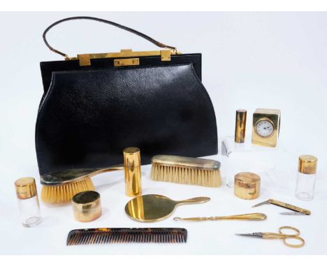 1920s Asprey black leather vanity handbag with silver gilt contents to include dressing table and manicure items, pair circul