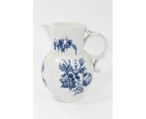 Worcester cabbage leaf moulded jug, circa 1770, with mask spout, decorated in underglaze blue with flowers, 20cm high