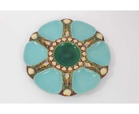 Victorian Minton Majolica oyster plate, decorated with light blue wells and a central green well, with shell decoration in re