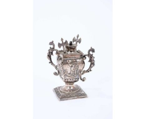 Late Victorian silver table cigar lighter, in the form of a classical urn, with raised female images and twin mythical beast 