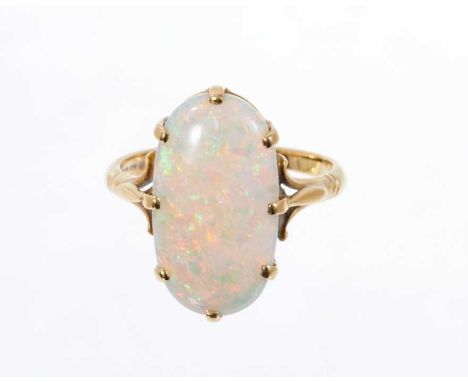 Opal single stone ring with an oval opal measuring approximately 18.5mm x 10mm on 18ct yellow gold shank. Ring size N½.Condit