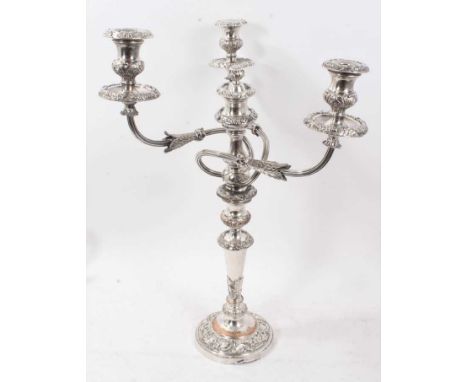 Old Sheffield plate three light candelabrum with scroll and leaf decoration. Height 58cm C.1820. A similar example see: Histo