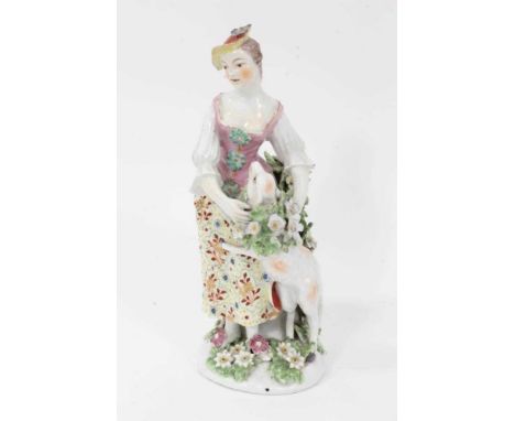 Derby figure of a shepherdess, circa 1760-65, polychrome and gilt decorated, shown garlanding a lamb, standing on a floral en