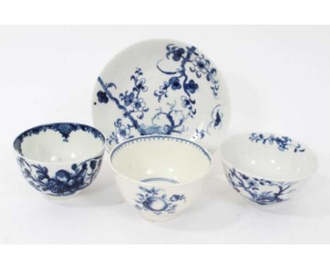 Worcester tea bowl and saucer, circa 1758, painted in blue with the Prunus Root pattern, together with two other Worcester bl