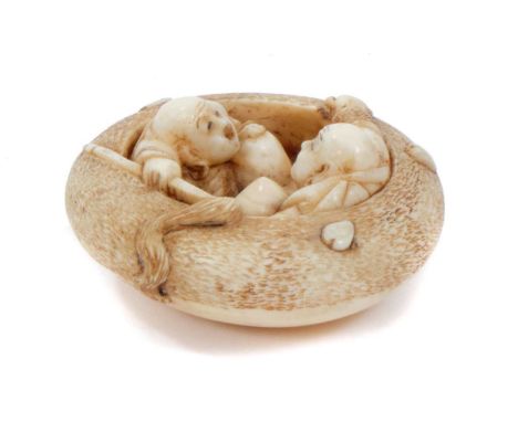 Fine Japanese carved ivory netsuke, carved as two figures in a boat, signed to underside, 4cm wide