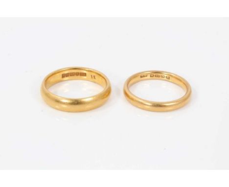 Two 22ct gold wedding rings, sizes J and K.Condition report: Gross weight approximately 8.3 grams 