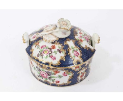 Worcester butter tub and cover, circa 1770, painted with flowers in gilt scrollwork panels, on a blue scale ground, crescent 