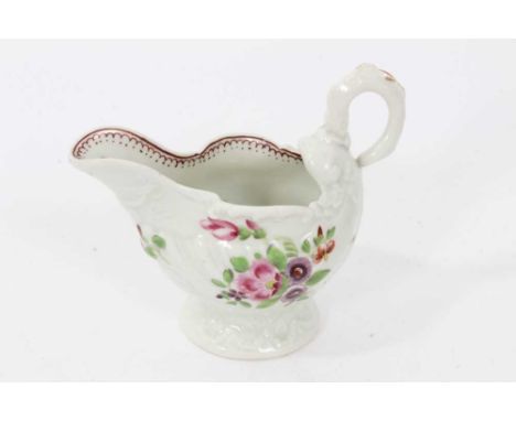 Worcester 'Dolphin Ewer', circa 1775, polychrome decorated with flowers, the inside rim with pattern in red, 8cm highConditio