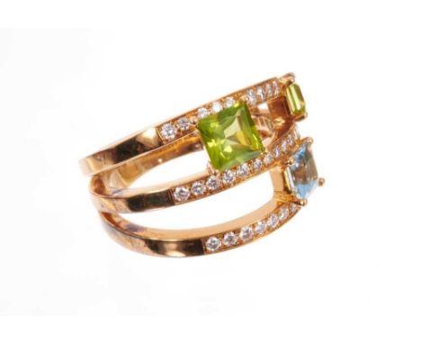 A diamond, aquamarine and peridot ‘Satellite’ three-row ring by Ritz Fine Jewellery of London, incorporating a 0.58cts prince