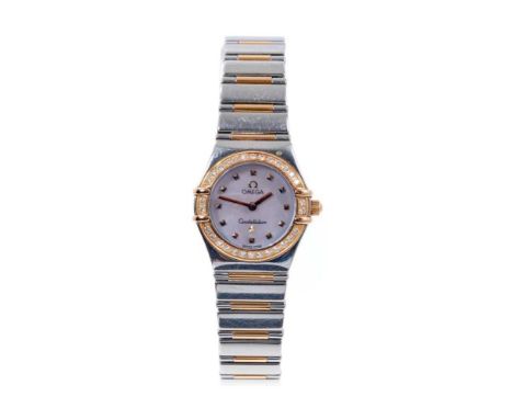 Ladies Omega Constellation wristwatch, the circular mother of pearl dial with gold dot hour markers, gold and diamond set bez