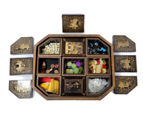 Early 19th century Chinese black lacquered and chinoiserie gilt gaming box, of typical cushion form with canted angles and or