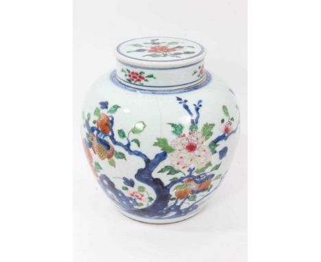 Chinese polychrome ginger jar and cover, 18th/19th century, decorated with flowers and blossoming trees, 23.5cm high includin