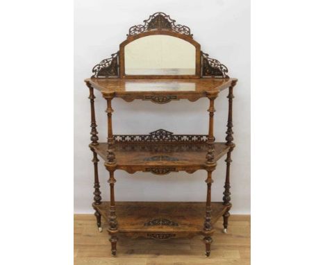 Victorian inlaid burr walnut veneered three tier whatnot with arched mirrored back, three marquetry inlaid shelves on carved 