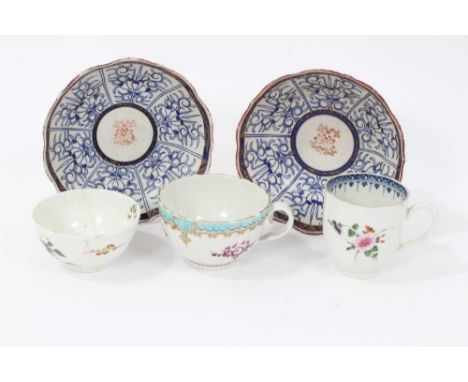 A Worcester coffee cup, a tea cup, a tea bowl in the Hibiscus pattern, and two Royal Lily pattern large saucers (5)