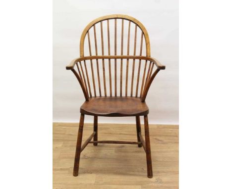 19th century ash and beech Windsor stick back elbow chair, with hooped back and saddle seat on turned legs and H-shaped stret