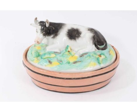 Victorian Staffordshire butter dish and cover, the cover modelled with a recumbent cow, measuring 18cm acrossCondition report