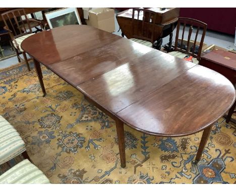 George III mahogany extending dining table, with D-shaped ends and central folding section, raised on square tapered legs and