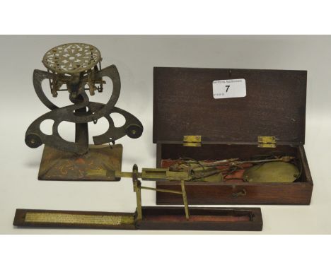 A set of Postage scales; a mahogany cased set of Apothecary scales; a set of mahogany cased Guinea scales (3)