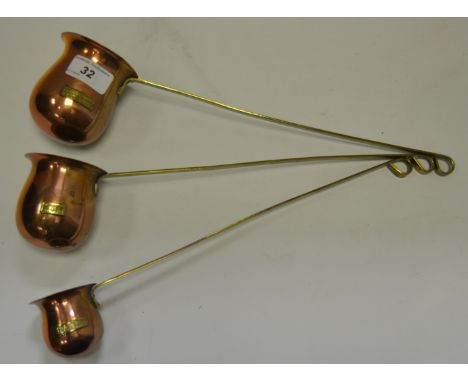 A copper and brass toddy ladle, Whisky, others; Brandy and Rum