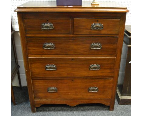 An early 20th century mahogany chest of two short above three long graduating drawers, over sized hand beaten copper escutche