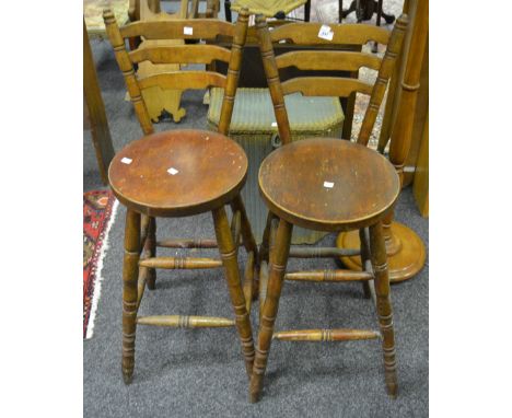A pair of pitch pine ladder-back bar stool, turned legs
