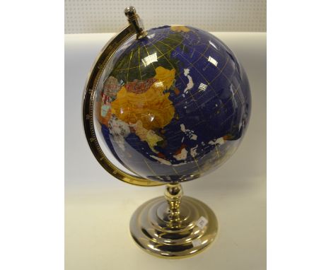 A table top gemstone globe, brass effect stand