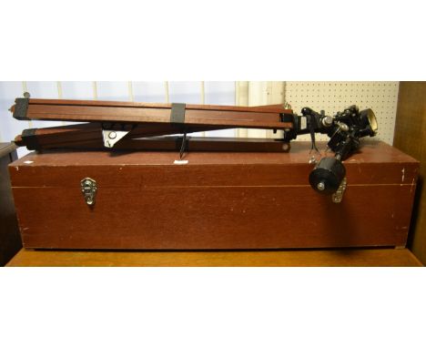An Astronomical  telescope, model 660, D + 76.2MM f = 1250, BOXED;  a wooden tripod stand