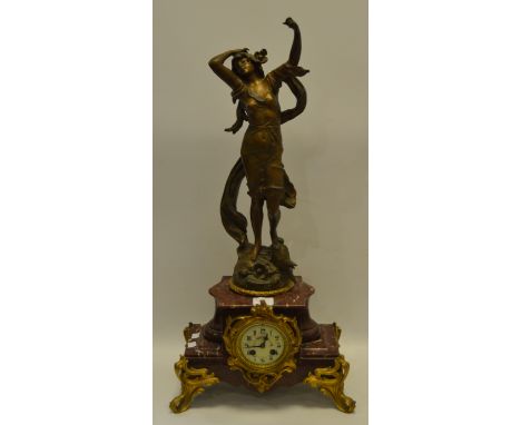A 19th century French figural and rouge marble mantel clock, 8cm diam, Arabic numerals, twin winding holes, gilt scroll mount
