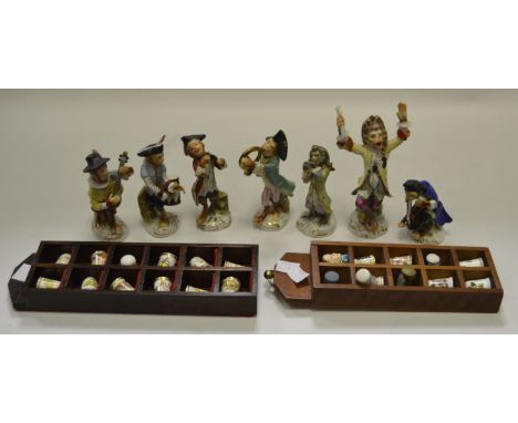 A  continental porcelain Monkey band; ceramic thimbles 
