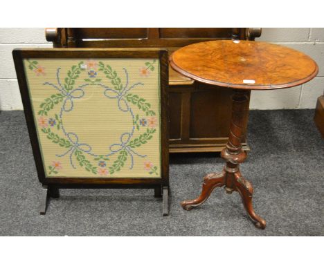 An early-20th century oak tapestry firescreen; a  Victorian burr walnut veneered oval dropleaf pedestal table c.1840 (2)