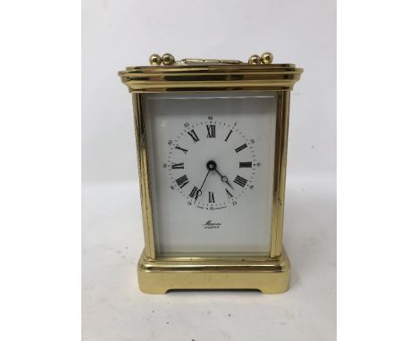 A brass carriage clock inscribed Masons Andover.