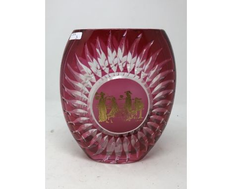 A heavy ruby glass vase of unusual design, decorated with a Chinese gilt panel and signed to the base.