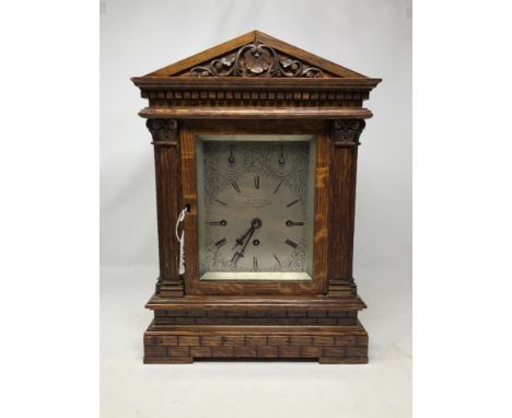 A late Victorian oak cased bracket clock by John Walker, 203 Regent Street and 77 Cornhill London. The 12cm square silvered d