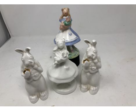 A collection of Alice in Wonderland ceramic figures.