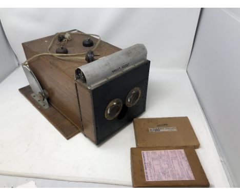 A box of magic lantern slides of scenic views of Scotland and Norway and a homemade viewer.