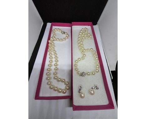 TWO STRINGS OF LARGE PEARLS AND A PAIR OF MATCHING PEARL AND CLEAR STONE DROP EARRINGS