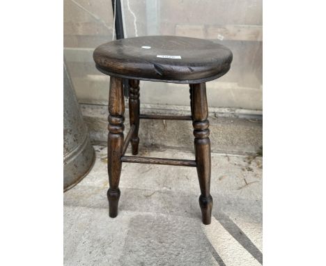 A VINTAGE BEECH FOUR LEGGED STOOL