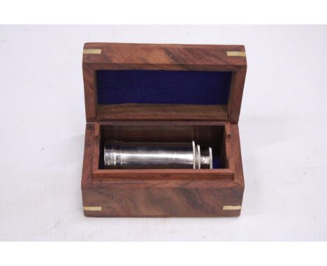 A BOXED CHROME TELESCOPE
