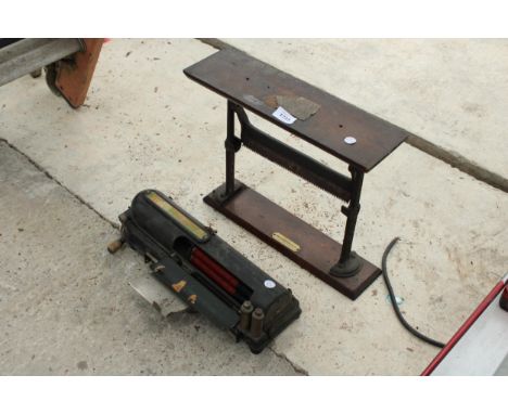 A VINTAGE TILL MACHINE WITH STAND