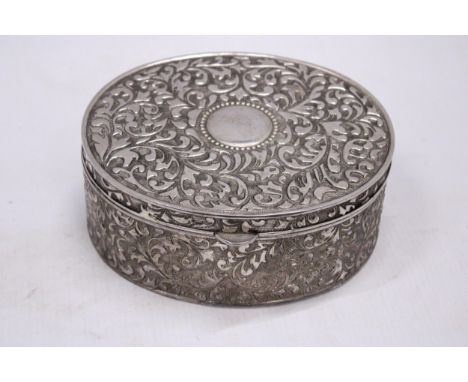 A LARGE VINTAGE SILVER PLATED OVAL REPOUSSE JEWELLERY CASKET