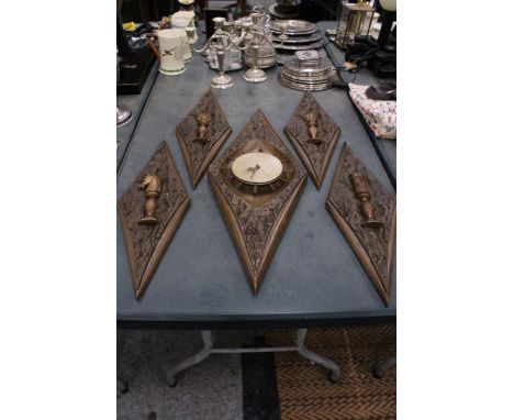 A VINTAGE STYLE WALL CLOCK AND FOUR PLAQUES, IN DIAMOND SHAPED FRAMES WITH CHESS STYLE DECORATION