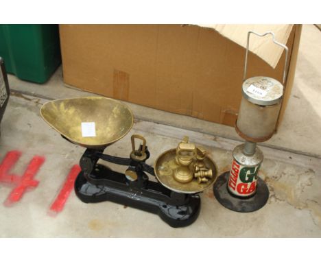 A SET OF VINTAGE BALANCE SCALES AND WEIGHTS AND A TORCH