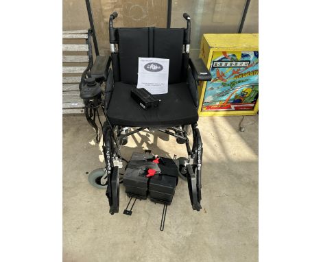 AN ENIGMA ENERGI BATTERY POWER WHEELCHAIR COMPLETE WITH MANUAL AND CHARGER