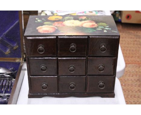 A VINTAGE NINE DRAWER WOODEN JEWELLERY BOX WITH PAINTED FLORAL DESIGN